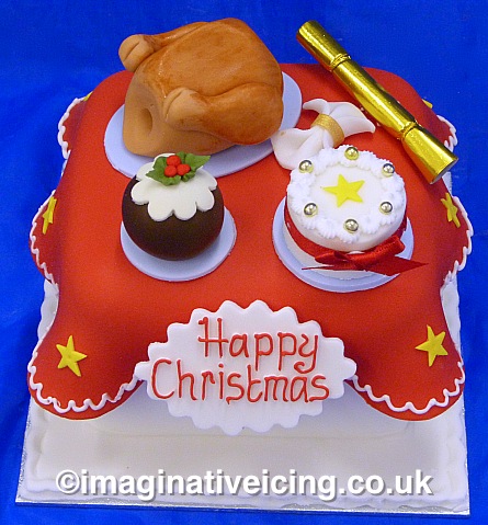 Now in stock! at Imaginative Icing York and Scarborough UK Shops - Ready Made Fully iced & decorated Christmas Cake Christmas Table with handmade sugar models of a roasted Turkey, Christmas Cake, Christmas Cracker, Christmas Pudding and Napkin - gift boxed with gift tag