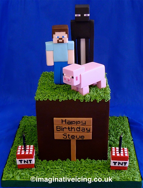Birthday Cake shaped as a Minecraft grass cube with Enderman, Steve and Pig characters plus some TNT candle holders