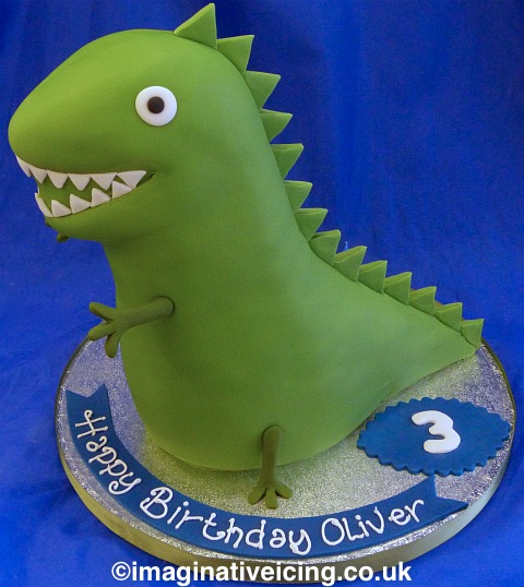 Green toy dinosaur cake